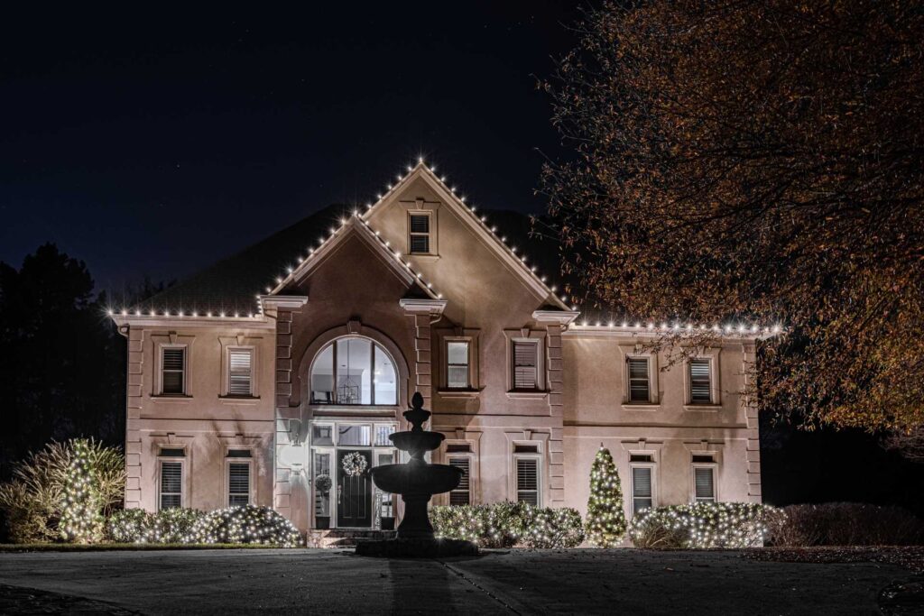 Elegant roofline Christmas lights on a large home